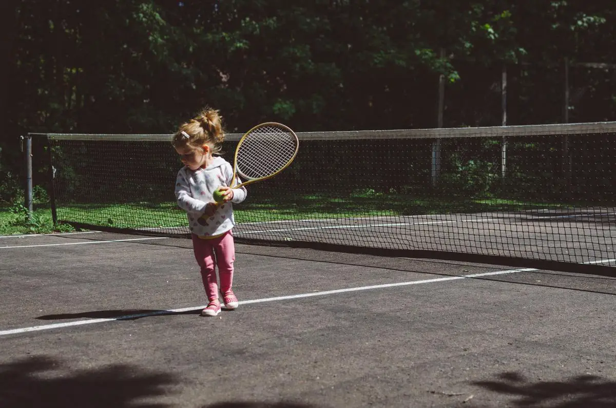 Illustration of two tennis players in action on a grass court