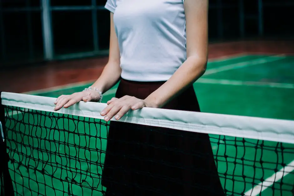 A professional tennis player holding a racket and looking at the ball, exemplifying the qualities of a professional tennis racket.