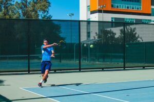 Tennis player, playing a strong forehand shot