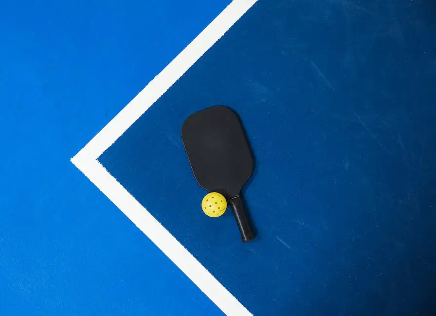 A person serving a pickleball with a paddle, ready to start a game