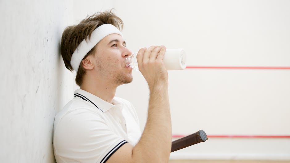 A group of squash players in action, showing their athleticism and focus on the court.