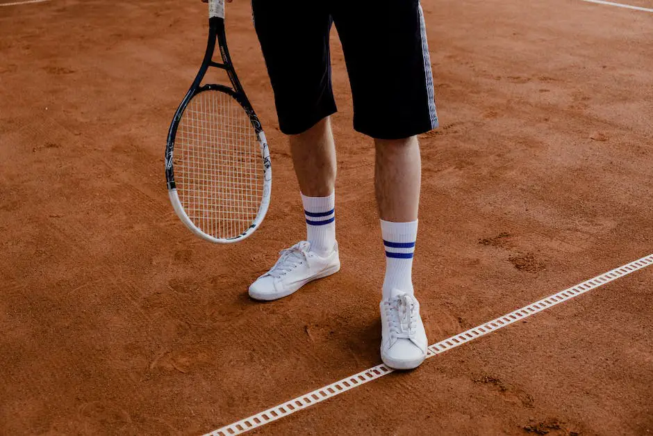 An image showing a tennis player resting and recovering after a match