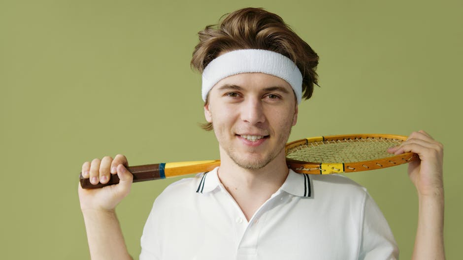 Illustration of a player correcting their grip on a squash racket.