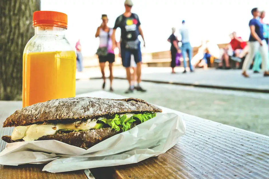 A person eating a healthy meal with various fruits, vegetables, and proteins.